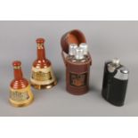 A leather cased triple flask set, chrome flask with leather case and two Bells Whisky bell