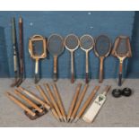 A quantity of vintage sporting equipment. Including tennis rackets, cricket bat & stumps, lawn