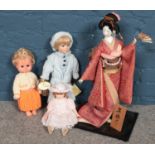 Four dolls. Including Geisha girl, Regency Fine Arts Wee Willie Winkie, etc.