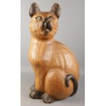 A large carved wooden model of a cat. Height 61cm.