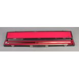 A cased Pro One three piece snooker cue.
