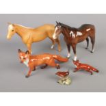 A quantity of Beswick figures including two horses, foxes and wren. Repair to leg of one horse.