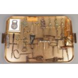 A tray of corkscrews and bottle openers. Including Christofle bottle opener, ornate brass
