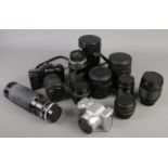 A collection of photographic equipment. Includes Pentax MZ 10, Panasonic, Vivitar and Tamron lenses.