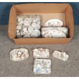 A box of miniature ceramics. Including mostly tea sets, etc.