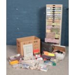 A very large collection of craft equipment together with drawered storage unit. To include beads,