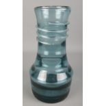 A Whitefriars style glass vase with trailing ribbon decoration. (28cm)
