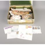 A collection of mostly loose British and World stamps including US, French and Spanish examples.