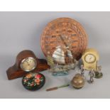 A quantity of miscellaneous items including carved year calendar, mantel clocks, brass bell etc.