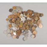A quantity of mostly pre-decimal British coins. Also contains some international and post-