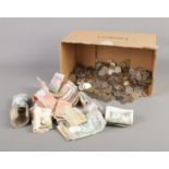 A large quantity of world coins and banknotes including American, Indonesian and Singaporean