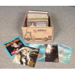 A box of LP records. Includes Abba, The Beach Boys, Boney M etc.
