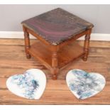 A Ducal pine coffee table with painted and varnished top along with two heart shaped oil on canvas.