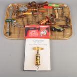 A tray of corkscrews and bottle openers along with a Bernard M Watney & Homer D Babbidge corkscrew
