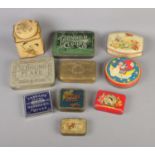 A quantity of vintage tins to include tobacco, toffee and commemorative examples.