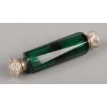 A green glass and white metal double ended scent bottle. Hinge broken.