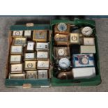 Two boxes of quartz clocks, mainly carriage examples. Top include Metamec, Kundo and Staiger etc.
