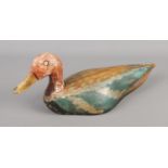 A painted softwood decoy duck.