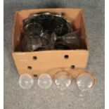 A box of assorted glassware to include cut glass bowl, drinking glasses and jug.