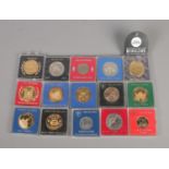 A quantity of Tower Mint medallions commemorating various UK locations including Isle of Man,