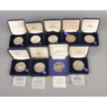 A quantity Tower Mint commemorative medallions in original presentation boxes. To include Castell