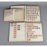 Three albums of world stamps including France, Italy, Dubai, Pakistan, etc.