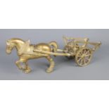 A brass model of a horse and cart.