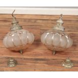 A pair of vintage glass and yellow metal light fittings.