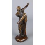 A oriental bronze figure of a man practicing martial arts. (23cm)