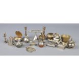 A box of miniature metalwares. Includes candlesticks, teapots, sewing machine etc.