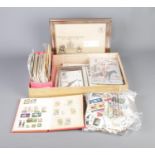 A quantity of loose stamps, First Day covers and stamp related postcards including international