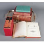 A tray of books including Noah Webster's Dictionary of the English Language (revised edition), The