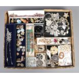 A large tray containing a good collection of vintage costume jewellery. To include approximately