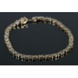 A 9ct Gold and Diamond bracelet. Stamped to clasp. Total weight: 5.67g