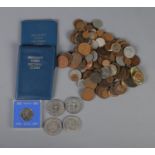 A quantity of mostly pre-decimal British coins including commemorative crowns and two sets of