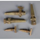 A collection of five brass keg taps.