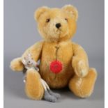 A Hermann Original mohair teddy bear, with small companion mouse. Height of bear: 26cm.