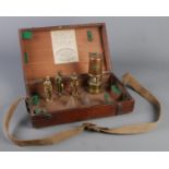A John Davis & Son wooden box with contents of mining collectables. Includes Welsh Davy lamp,