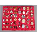 A collection of approximately forty-five costume jewellery brooches. To include cameo, bow and