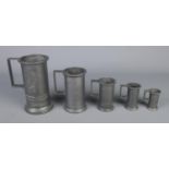 Five graduated pewter tankards.