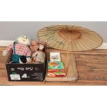 A box of miscellaneous items, to include ceramic dolls, vintage games and toys and parasol.