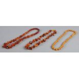 Three amber/copal necklaces of varying size, including one beaded example. 118.86g