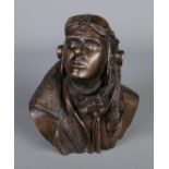 A bronze bust depicting a fighter pilot, Signed RS to the back. (17cm)