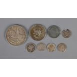 A quantity of silver coins including 1935 crown, 1953 half dollar, several three pences, etc.
