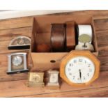 A box of mostly quartz clocks including carriage, mantel and wall examples.