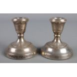 A pair of silver filled dwarf candlesticks. Assayed Birmingham 1979 by Parkin Silversmiths Ltd.