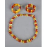 A amber/copal bead necklace along with two amber/copal bracelets.