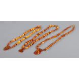 Three amber/copal necklaces, with large pendant pieces. 66.36g.