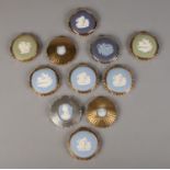 A collection of eleven Stratton powder compacts, with Wedgwood front cameo plaques. All stamped