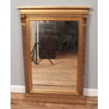 A gilt framed rectangular mirror, with Corinthian style border. Height: 101cm, Width: 71cm.